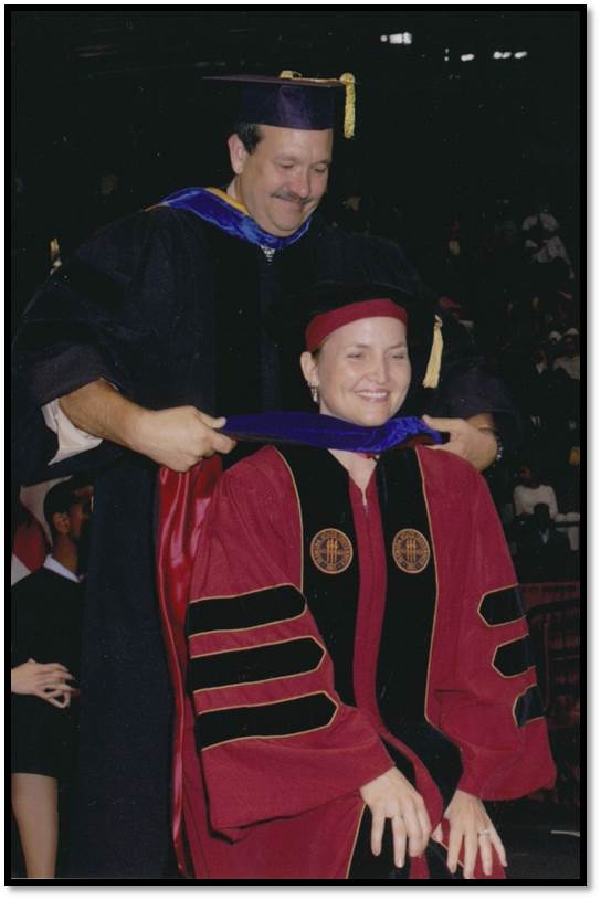 Graduating with PhD from Florida State University, 2006.